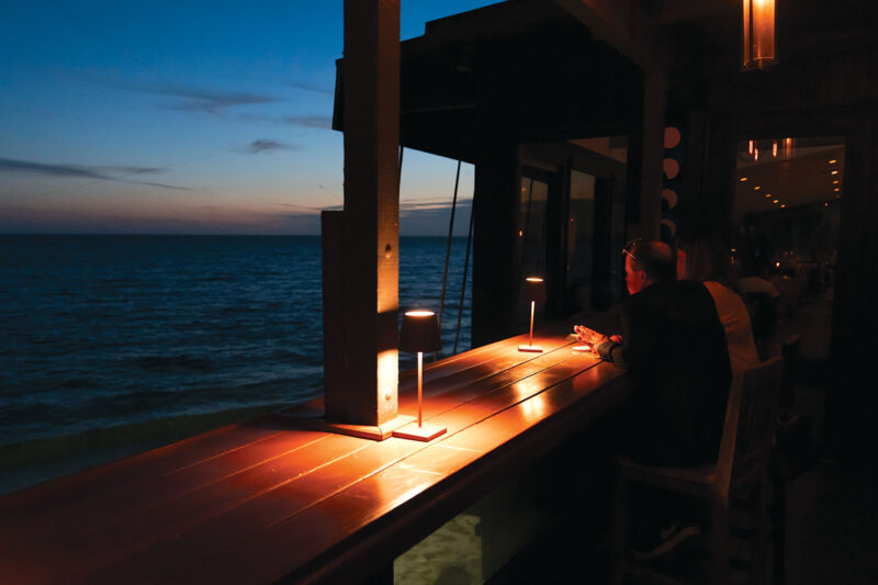 Moonshadows Malibu - Small patio on beautiful beach during sunset