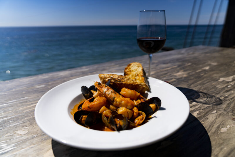 Moonshadows Malibu - California Style Bouillabaisse, Santa Barbara Prawns, Bay Scallops, Mussels, Clams, Squid, Sea Bass, Tomato, Ciabatta Bread
