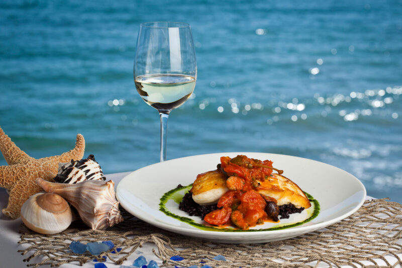 Moonshadows Malibu - Oven roasted chilean sea bass & a glass of white wine