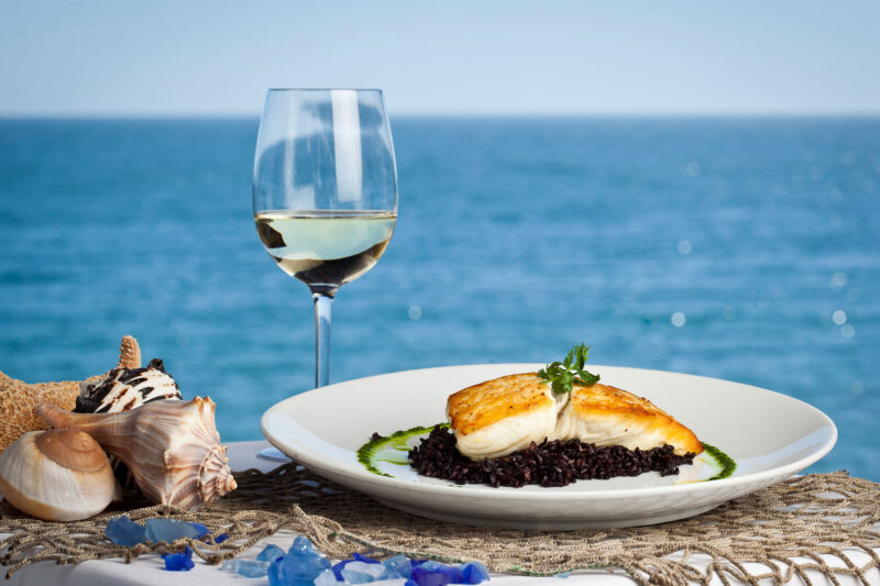 Moonshadows Malibu - Oven roasted chilean sea bass & a glass of white wine